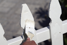 Brush Painting White Fence in Charlotte NC